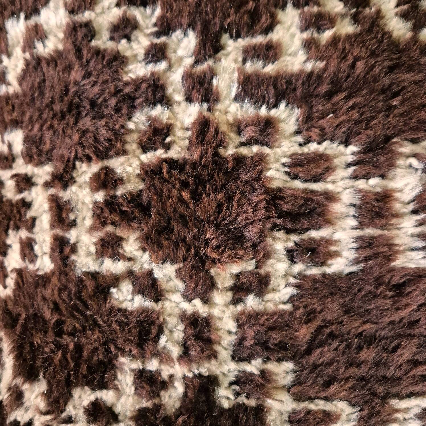 Cushion cover in an ancient Berber rug.