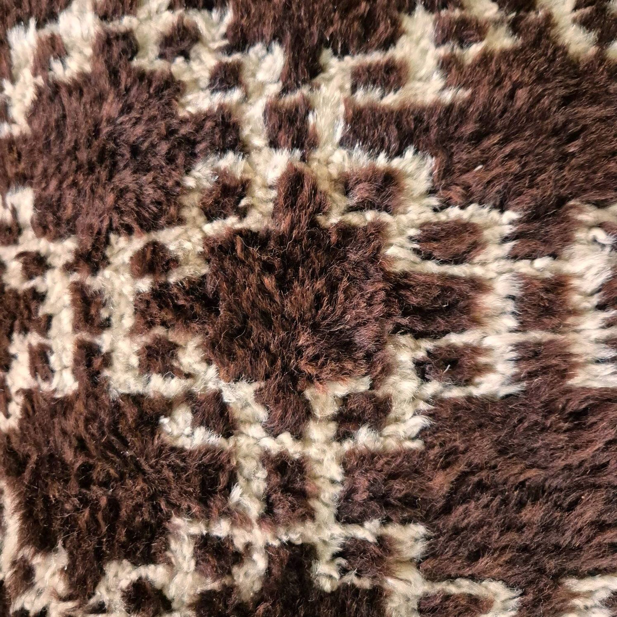 Cushion cover in an ancient Berber rug.