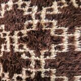 Cushion cover in an ancient Berber rug.