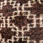 Cushion cover in an ancient Berber rug.