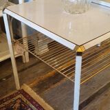 White coffee table and vintage gold metal