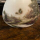 Art Deco opal vase with landscape decoration.