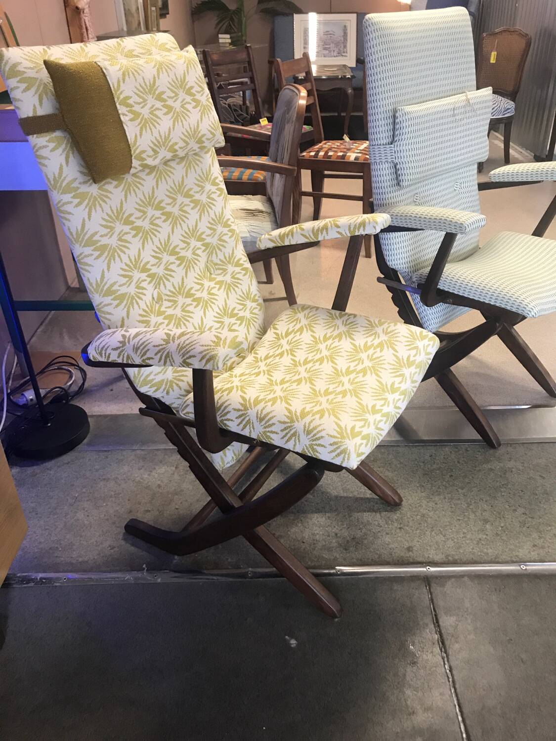Rocking lounge chair made of fabric suitable for outdoor use.