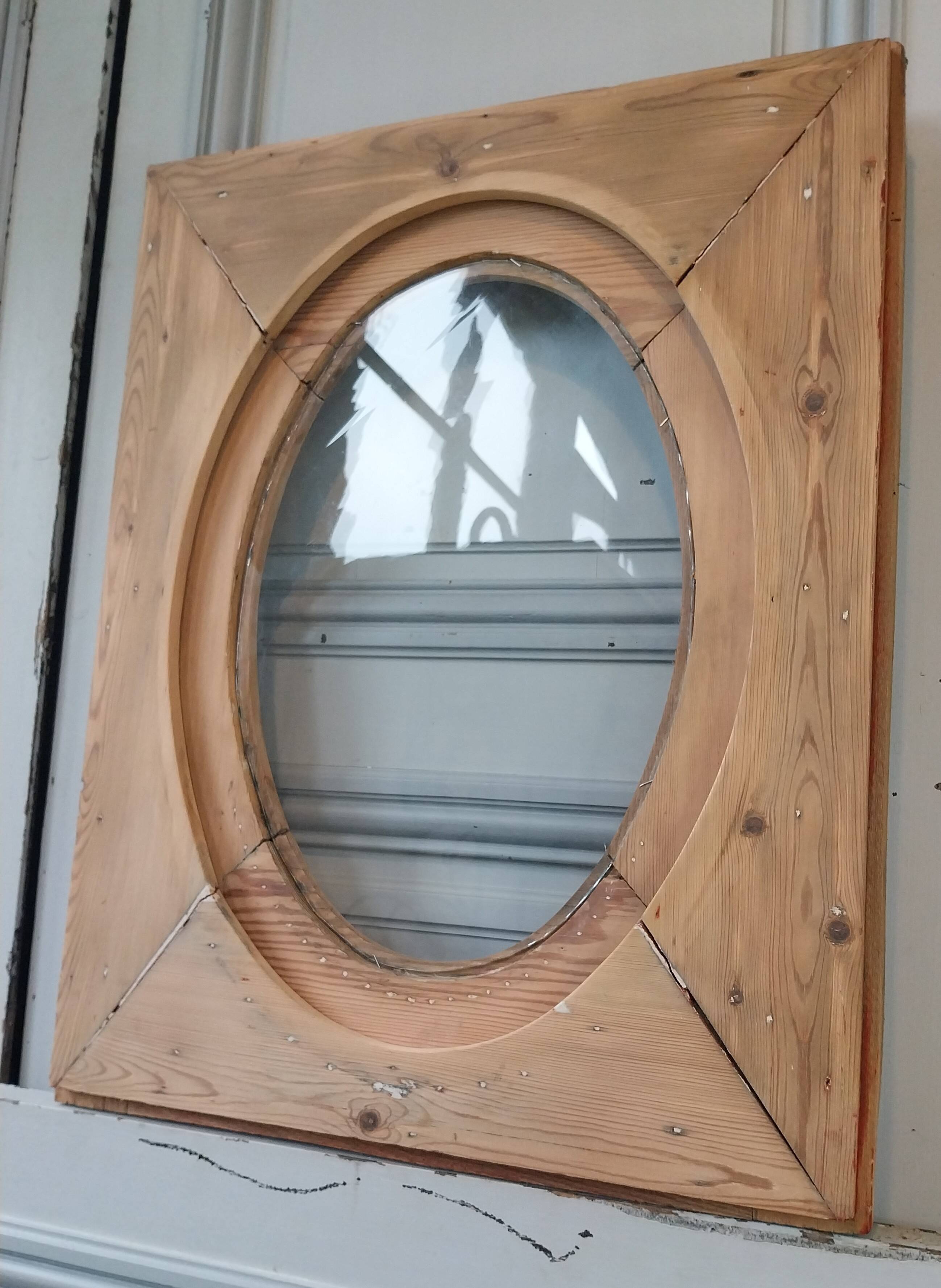 Old bullseye window with oval glass