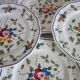 12 anciennes assiettes à dessert Longchamp décor fleuri