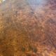 Oval extendable dining table in wood and walnut burl veneer.