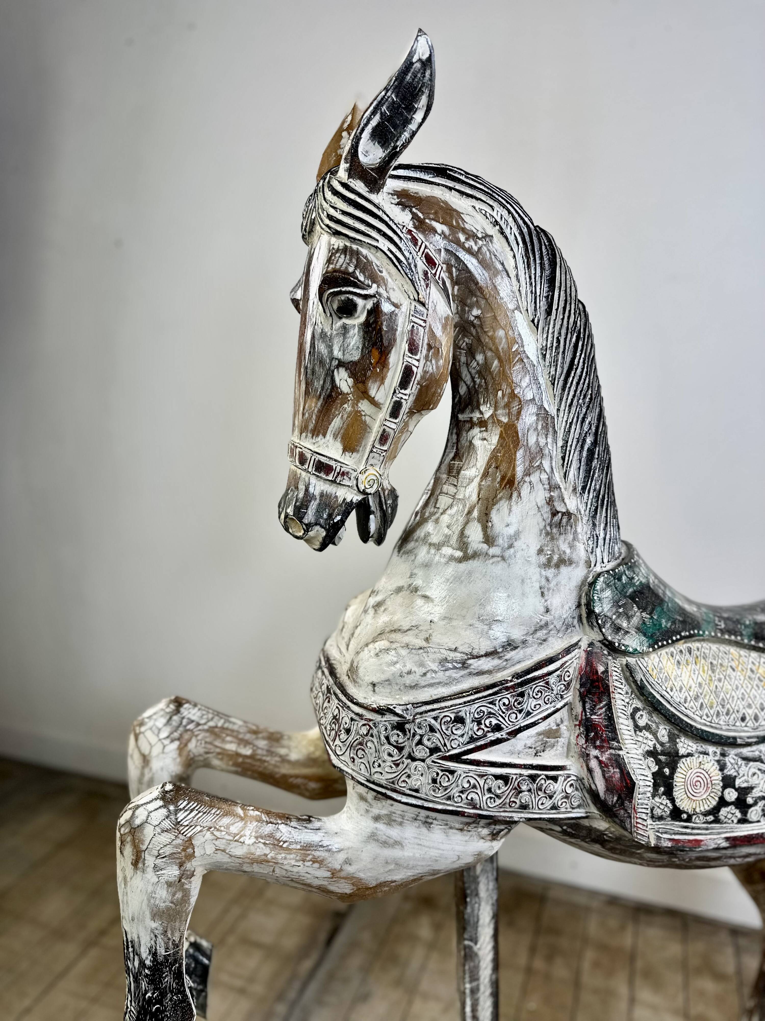 Carved and patinated wooden carousel horse