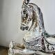 Carved and patinated wooden carousel horse