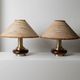 Lot of 2 vintage table lamps from the 1970s, dark wood oval bases with curved brass details, handmade natural fibre lampshades, elegant lighting.