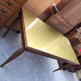 Dining table in the style of Paolo Buffa, made of brown wood with a tinted glass top.