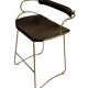 Organic bar stool with a vintage brass backrest and brown leather.
