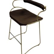 Organic bar stool with a vintage brass backrest and brown leather.