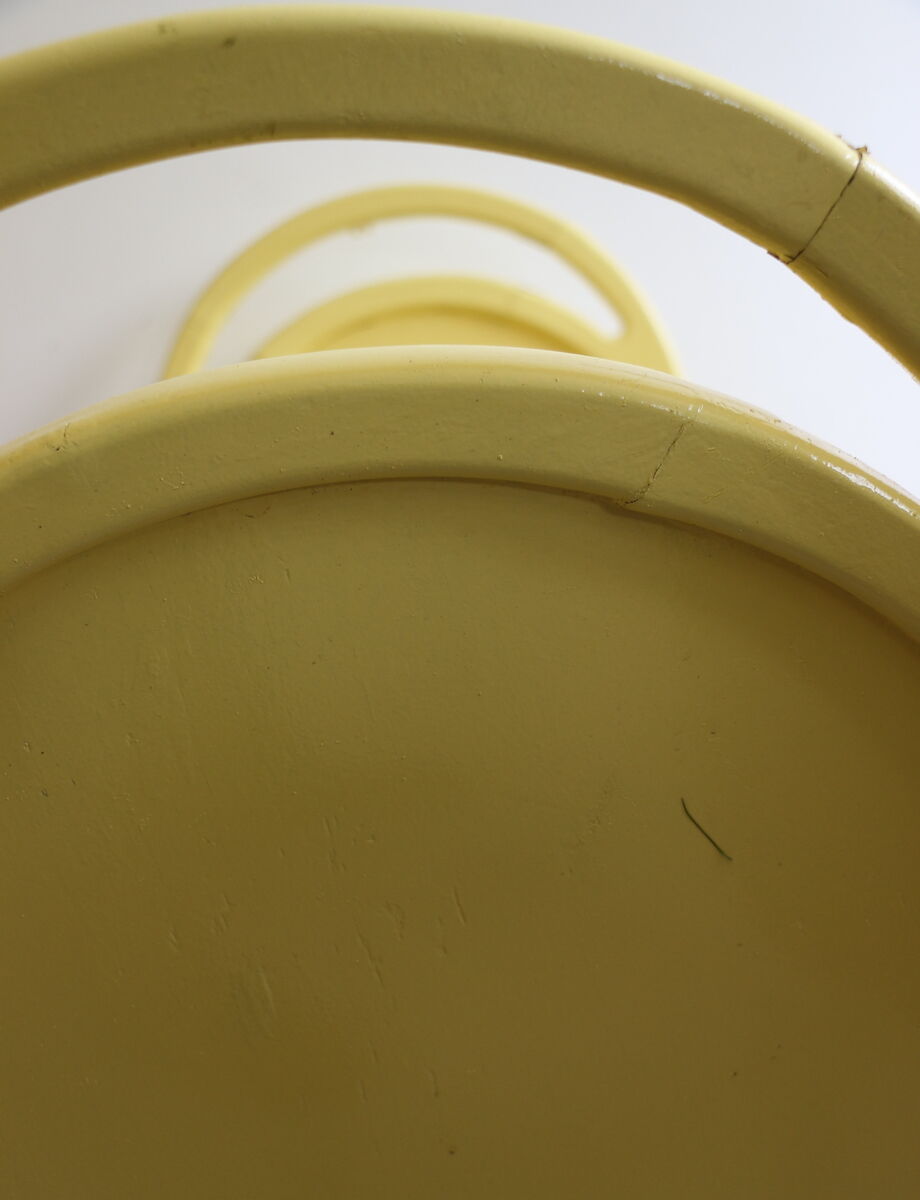 Yellow vintage baby cot