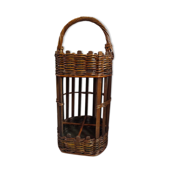 Portable bar or wicker bottle storage with wooden cladding.