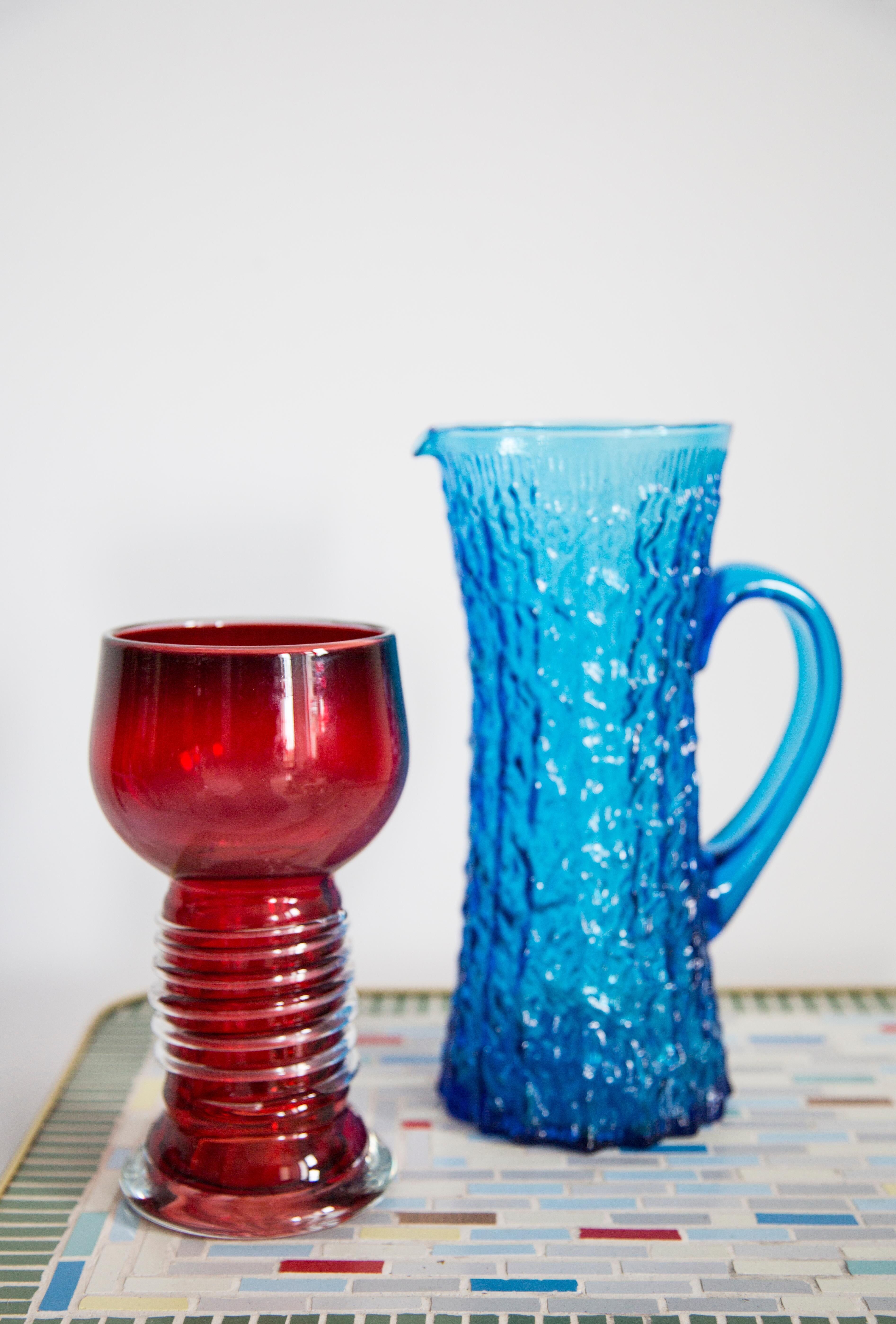 Blue glass water or juice pitcher from the mid-20th century.