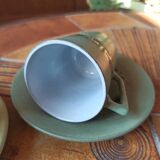 A pair of vintage glazed stoneware cups and saucers.