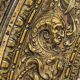 A. Arens, Antwerp, important oval mirror in repoussé brass with numerous animal decorations