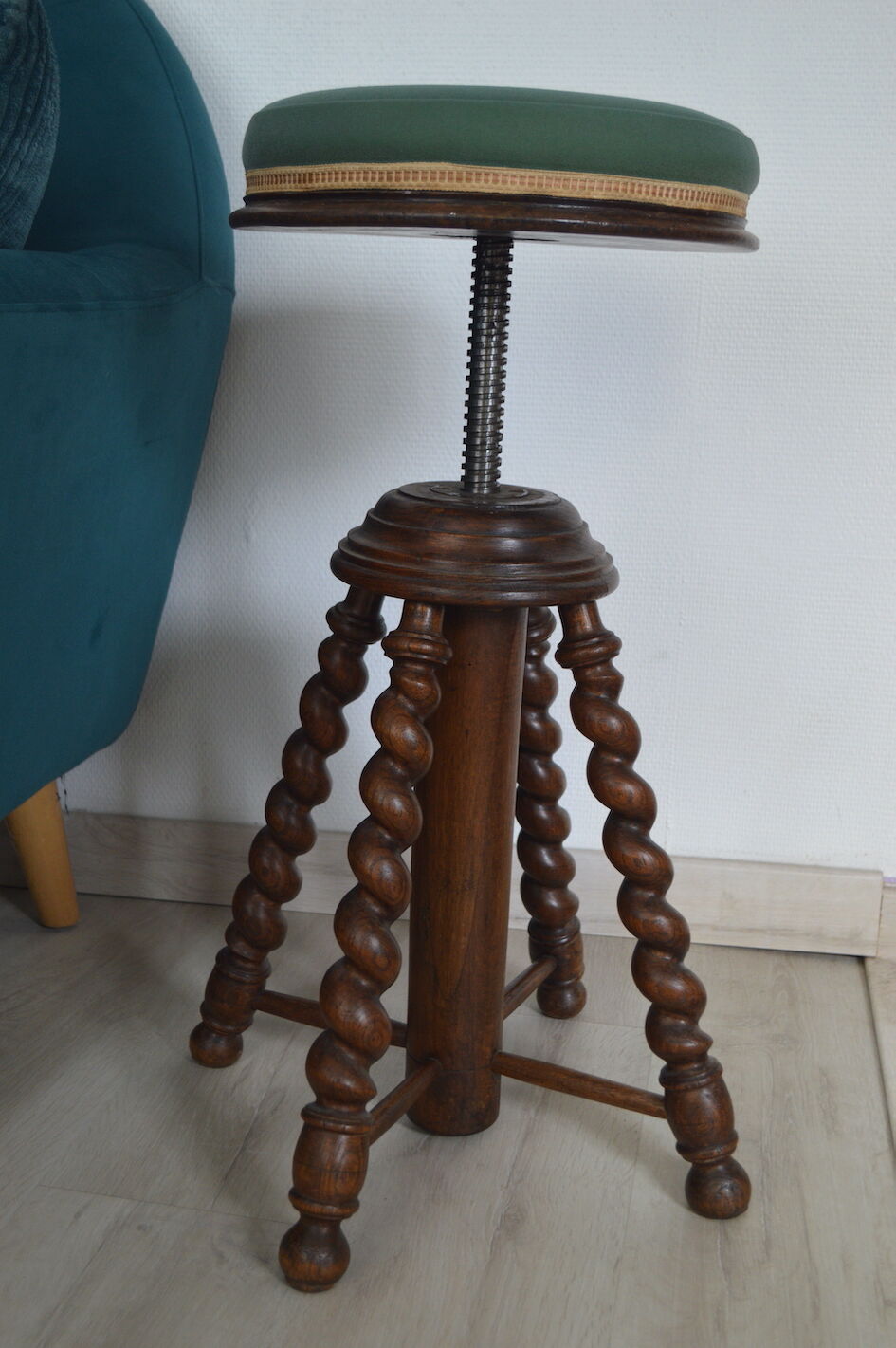 Antique piano stool with adjustable screws and turned wooden legs