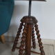 Antique piano stool with adjustable screws and turned wooden legs