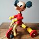 Old Mickey Mouse toy on his wooden tricycle