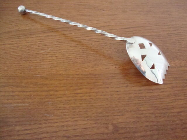 Silver metal sprinkling spoon