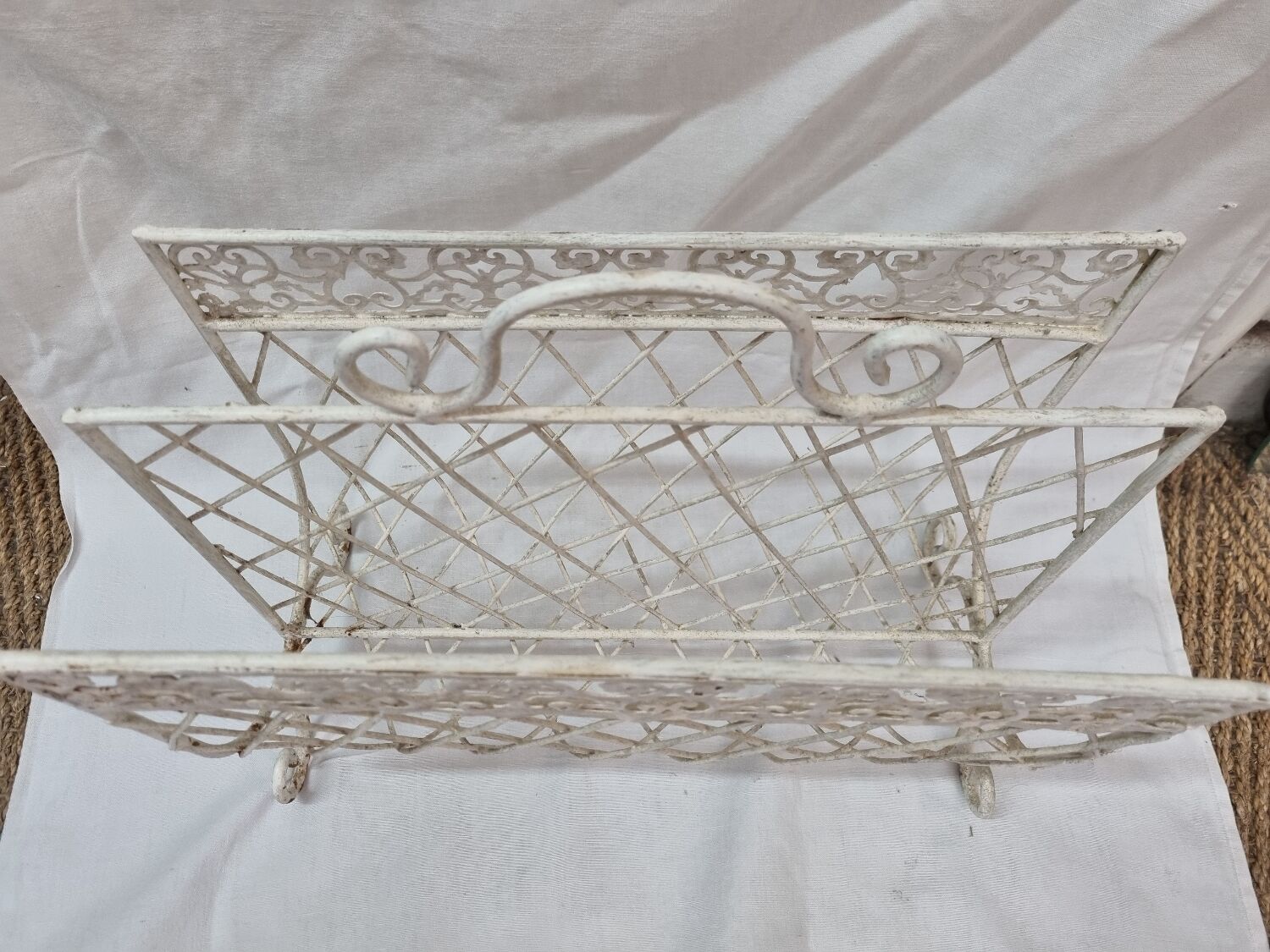 White wrought iron magazine holder