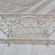 White wrought iron magazine holder