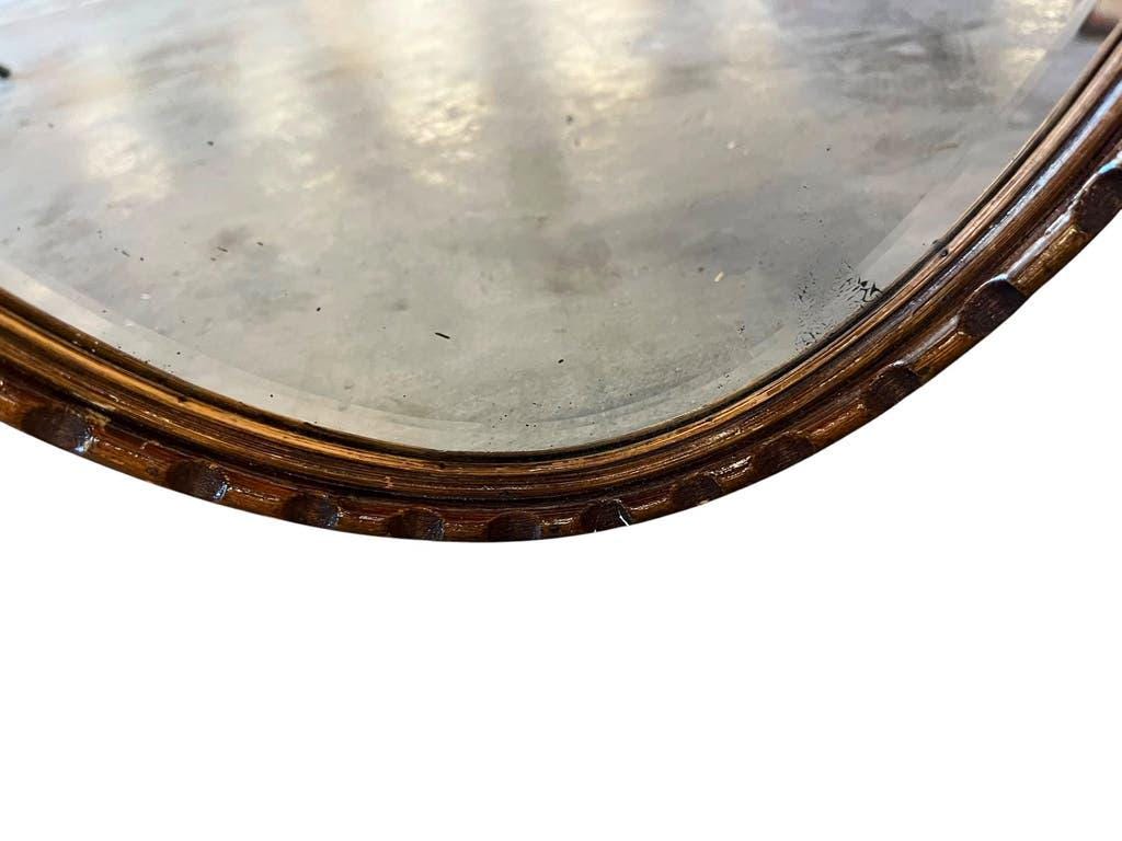 Robust vintage oval wall mirror in wood