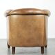 Vintage sheepskin club armchair finished with decorative nails