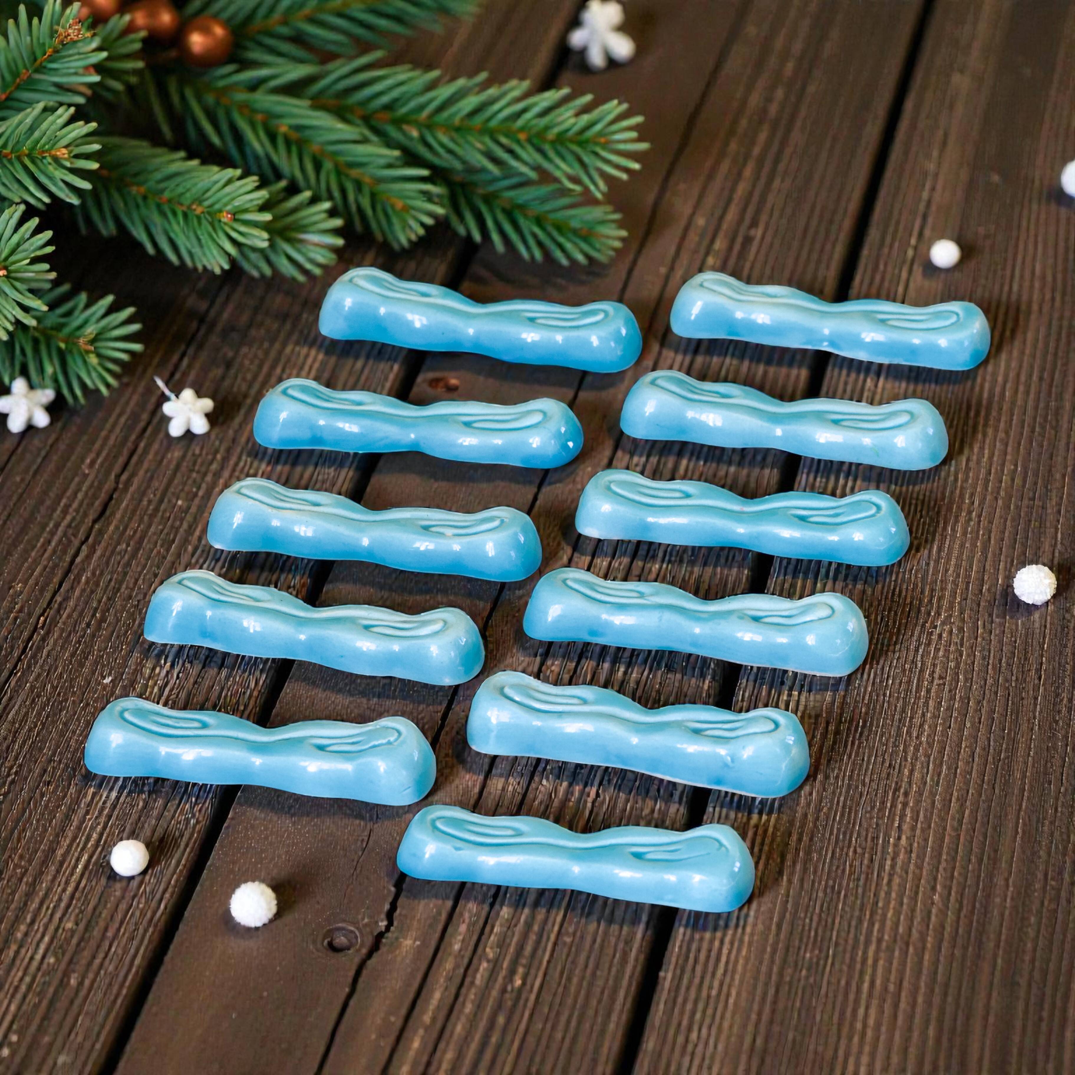 Antique Art Deco knife rest in turquoise earthenware