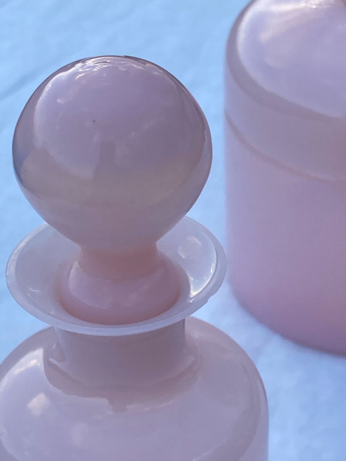 Two pink opaline bottles