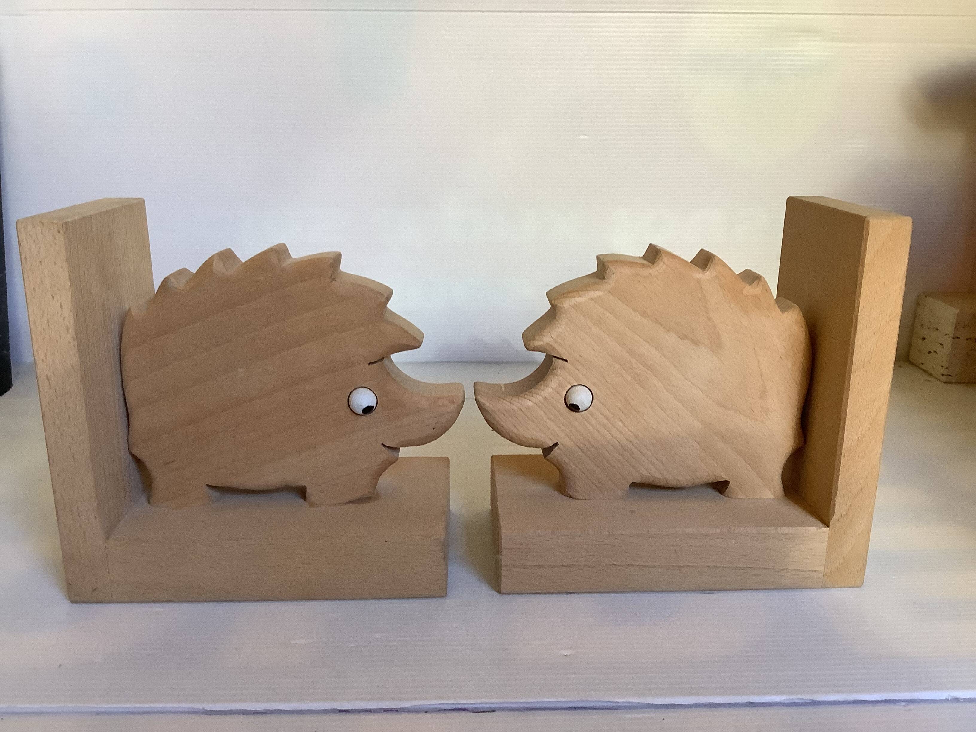 Pair of wooden hedgehog bookends