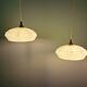 Pair of Art Deco light fixtures in light green speckled glass, 1930s.