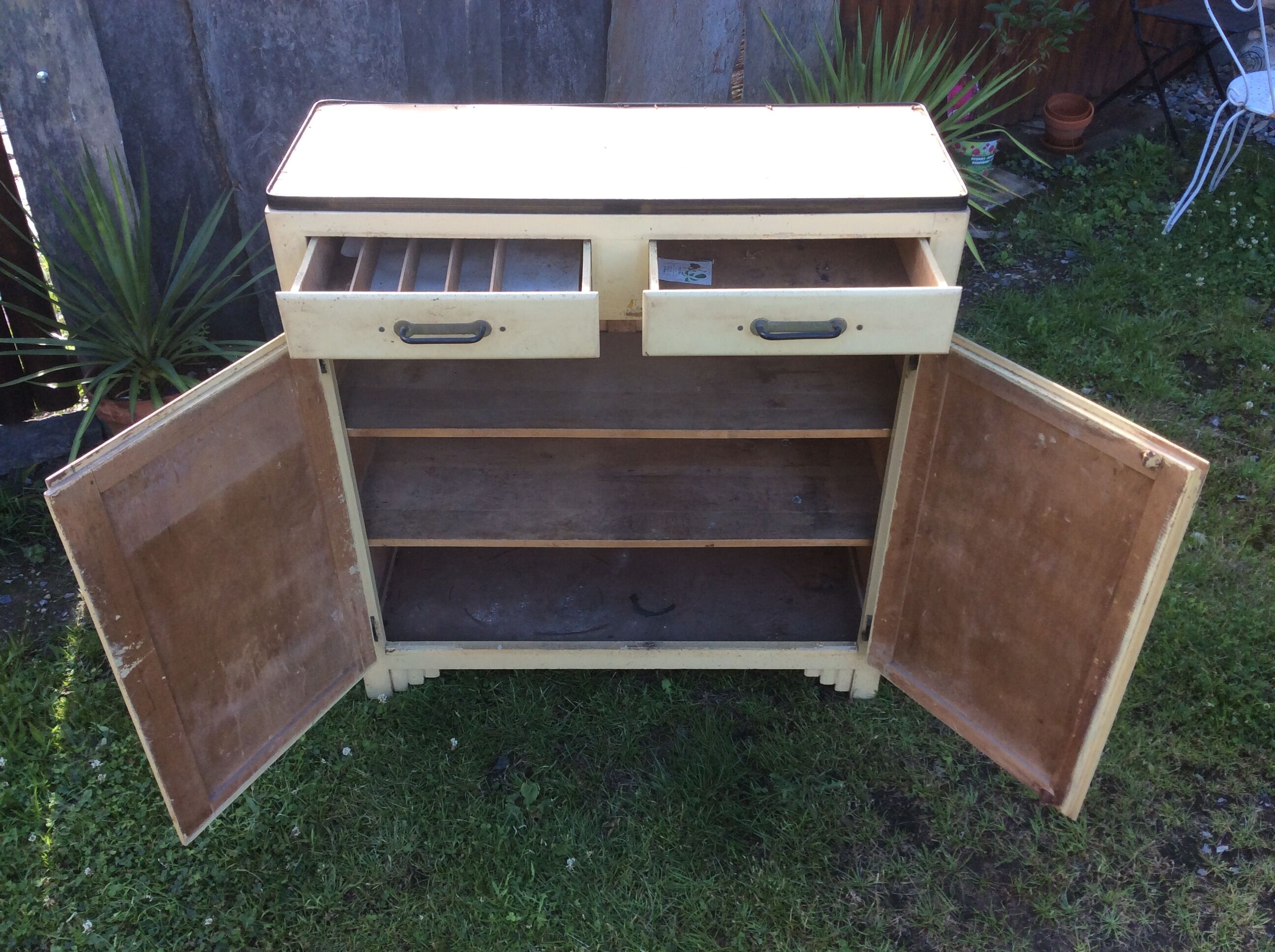 Parisian buffet painted in yellow with 2 doors and 2 drawers from an old Trailer.