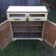 Parisian buffet painted in yellow with 2 doors and 2 drawers from an old Trailer.