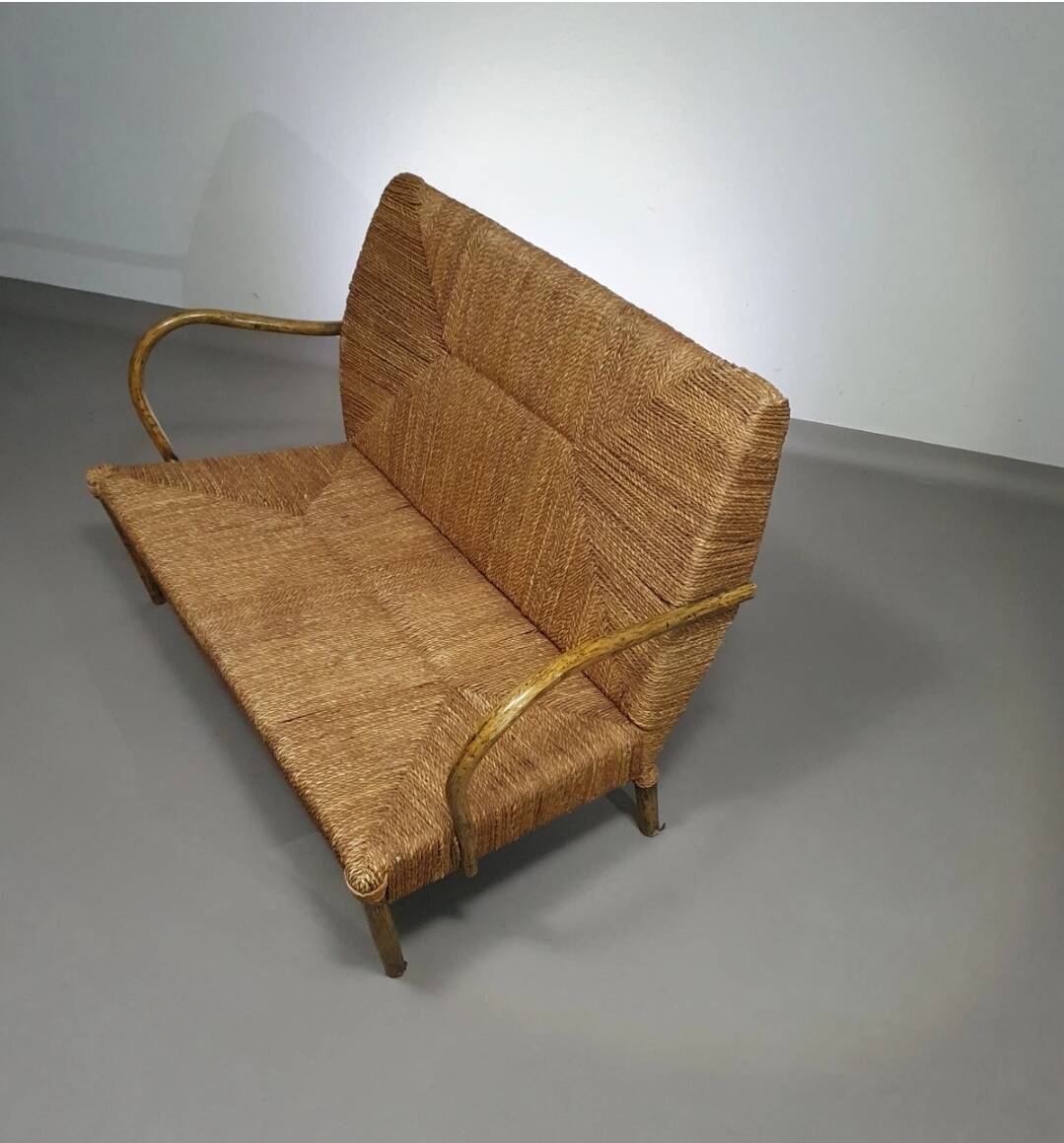 Vintage French papercord sofa with a metal frame base