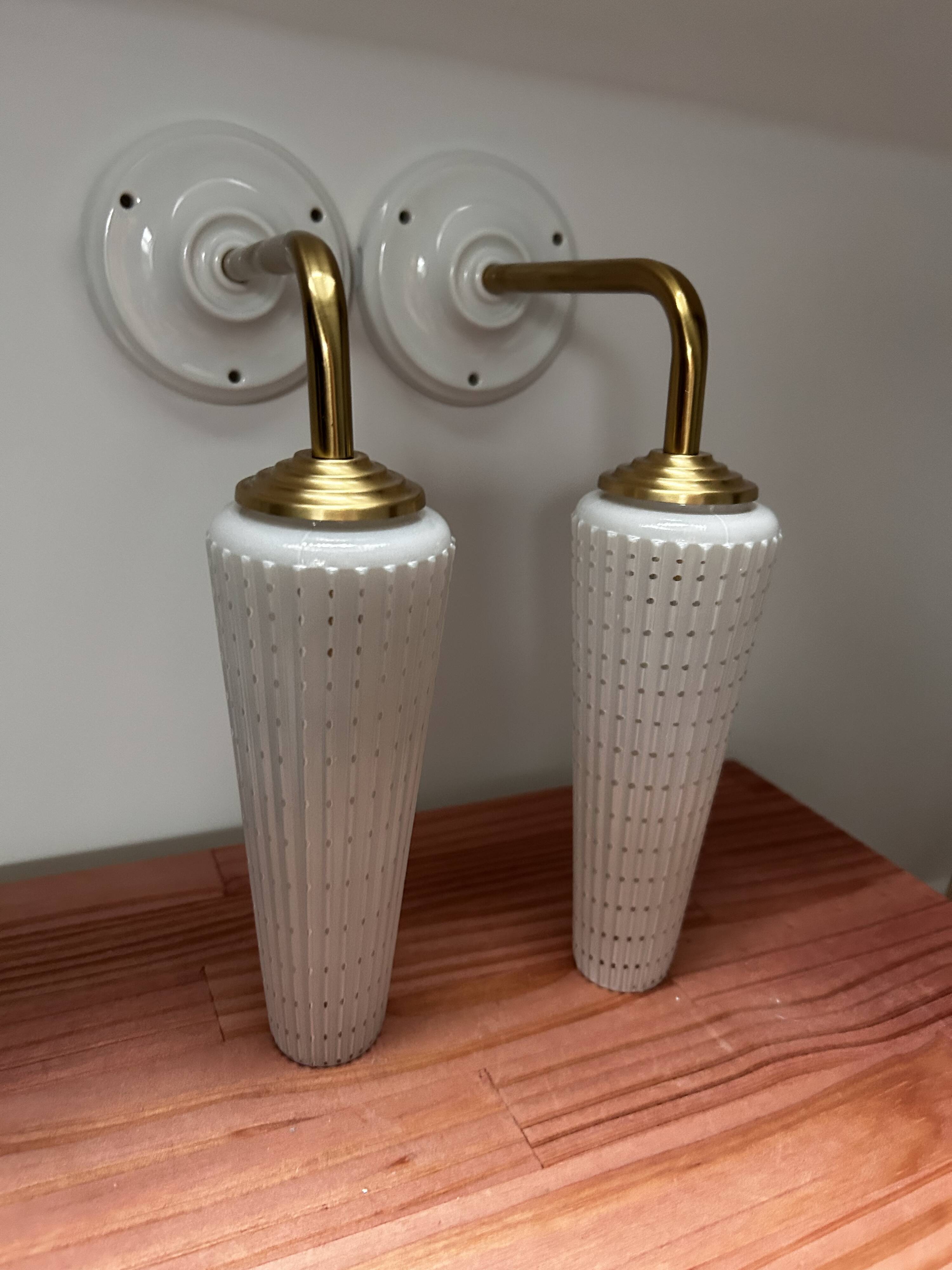 Pair of white and gold wall sconces