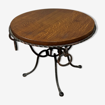 Hammered iron coffee table with circular wooden top