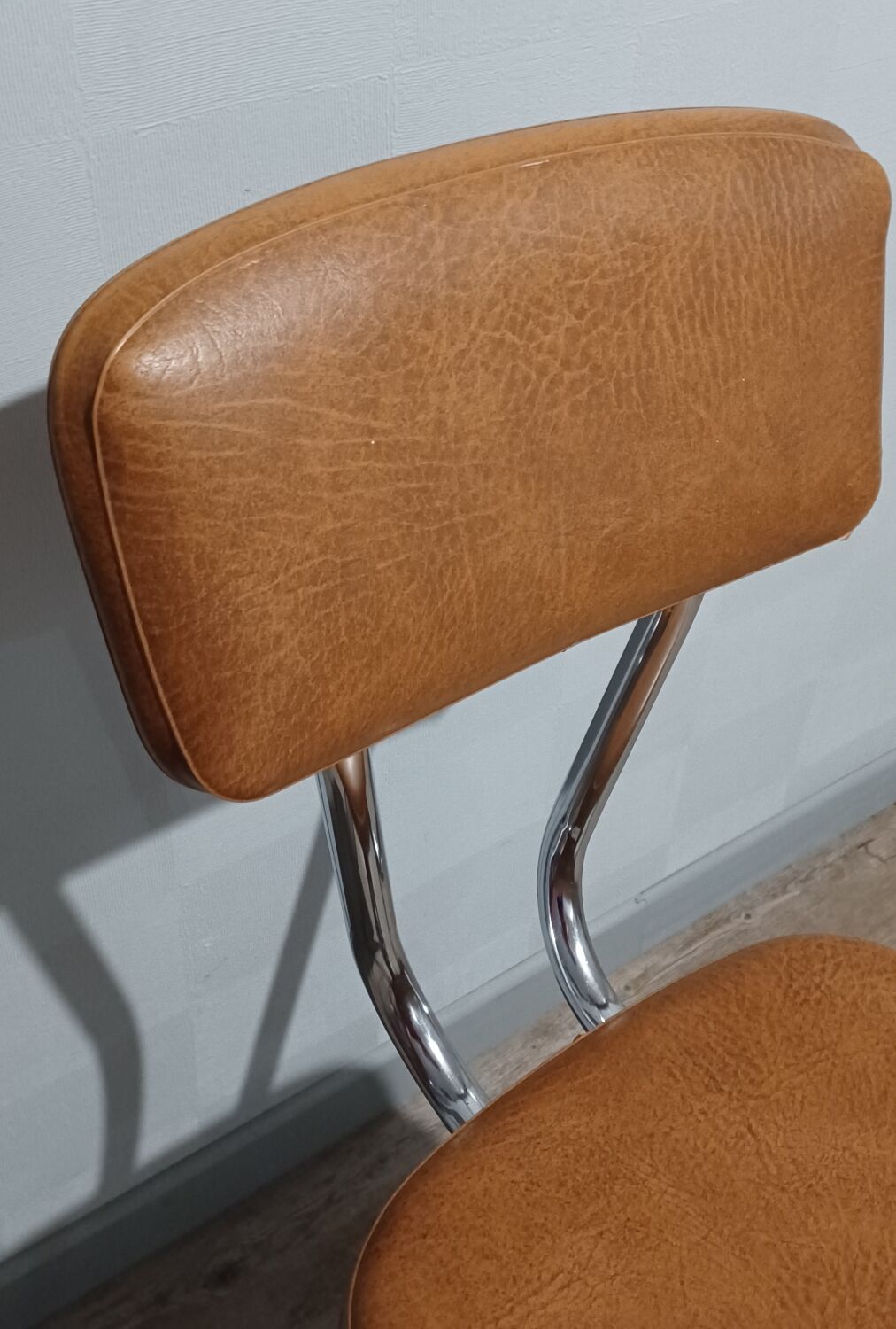 Pair of vintage faux leather and chrome chairs