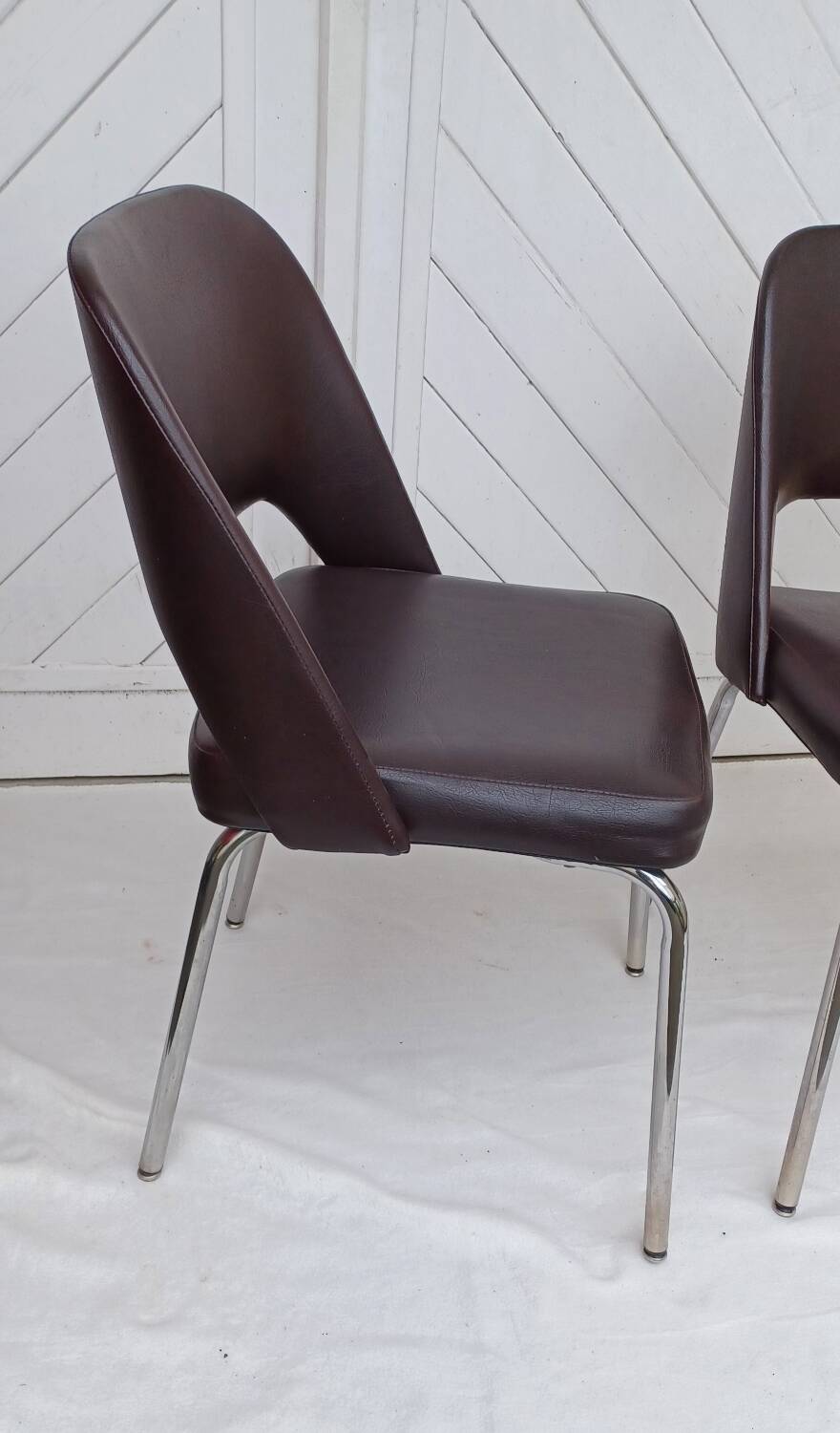 Pair of vintage faux leather and chrome armchairs