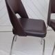 Pair of vintage faux leather and chrome armchairs