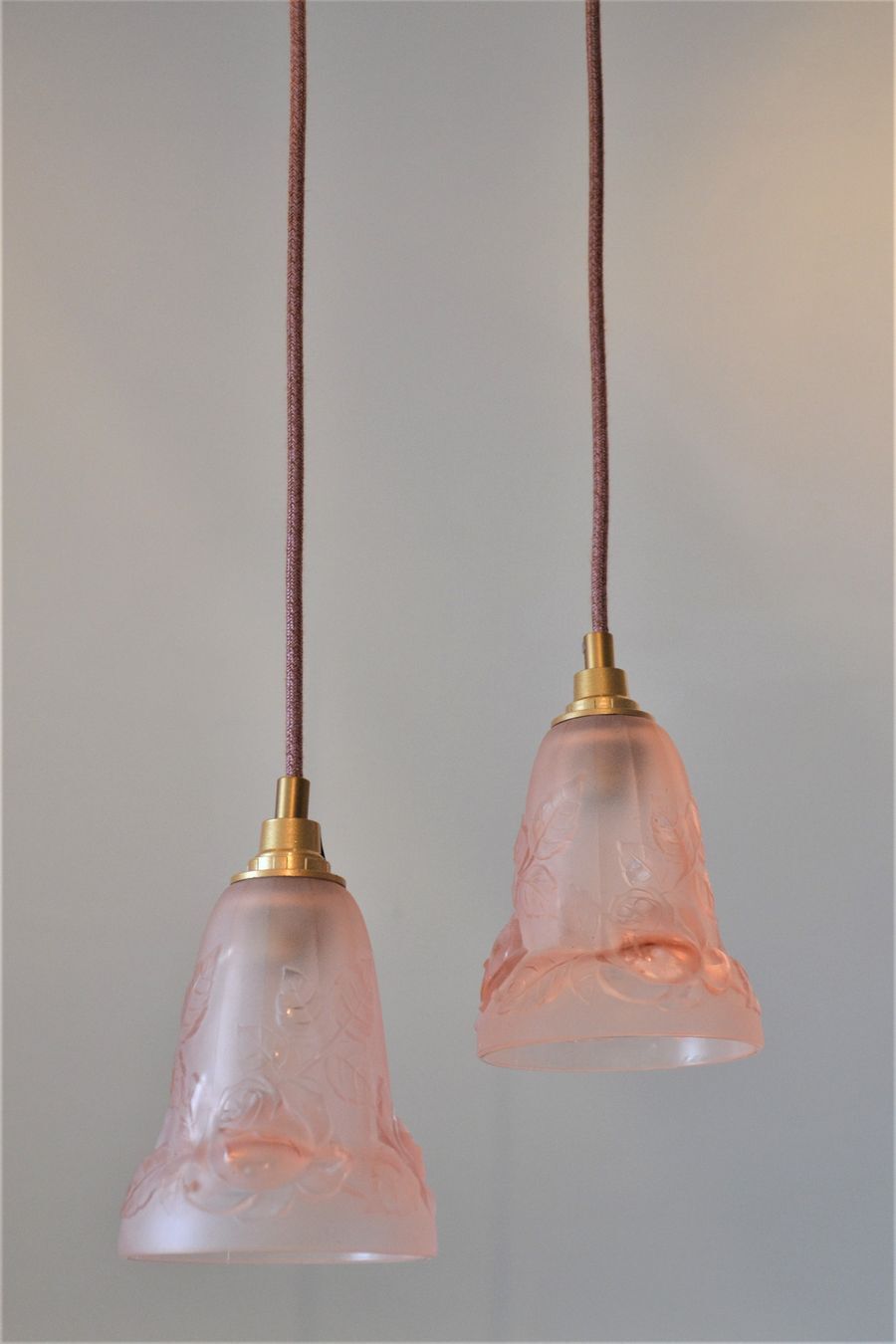 Pair of art nouveau style pendants in pink molded glass