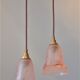 Pair of art nouveau style pendants in pink molded glass