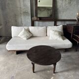 Coffee table, round antique Indonesian teak table with straight legs.