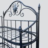 Old wrought iron garden shelf for plants
