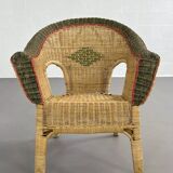 Rattan and wicker cabriolet-style armchair with green and red edging