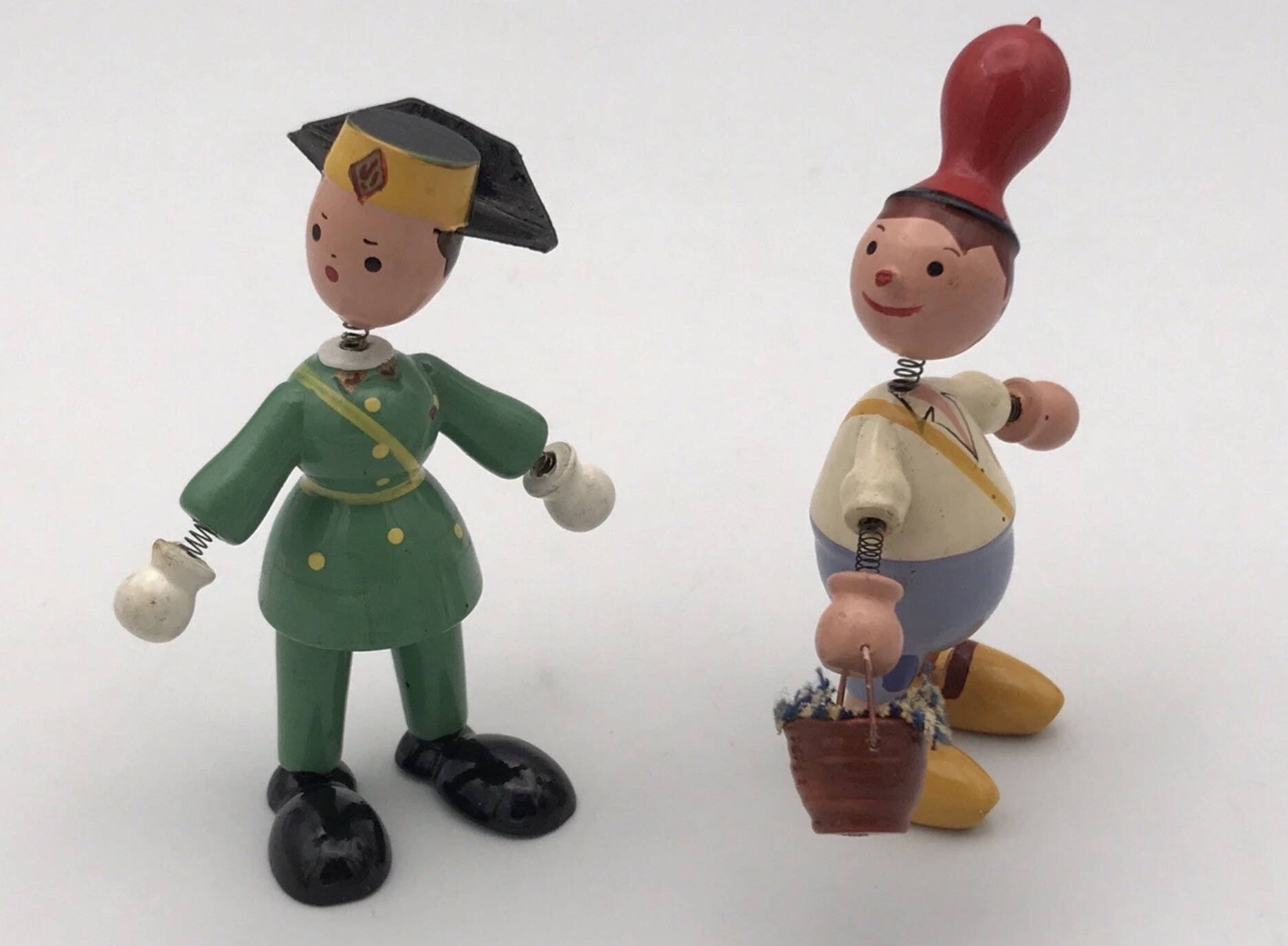 Set of 2 vintage GOULA wooden toy figurines with spring.