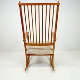 Mid-century rocking chair in pine and sheepskin by Yngve Ekström, Sweden.