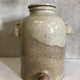 Old vinaigrier in sandstone vintage pot