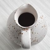 Handcrafted pitcher, speckled white ceramic
